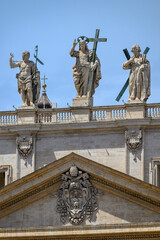 Obraz premium Christ the Redeemer (by Cristoforo Stati) flanked by St John the Baptist and St Andrew the Apostle atop St Peter’s Basilica in Rome.