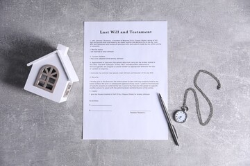 Naklejka premium Last Will and Testament, house model, pen and chain watch on grey background, flat lay
