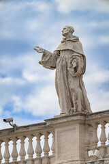 Saint Bernard of Clairvaux, sculpted by Lazzaro Morelli, atop the North Colonnade of St Peter&rsquo;s Basilica in Vatican, Rome, Italy.