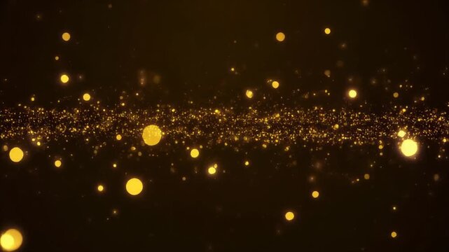 Golden particles falling against a dark background with bokeh effect for luxury or celebration theme