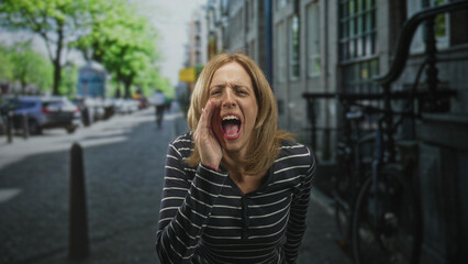 Fototapeta premium Woman cupping hands to mouth shouting on a busy city street near parked bicycles; urgent alert panic.