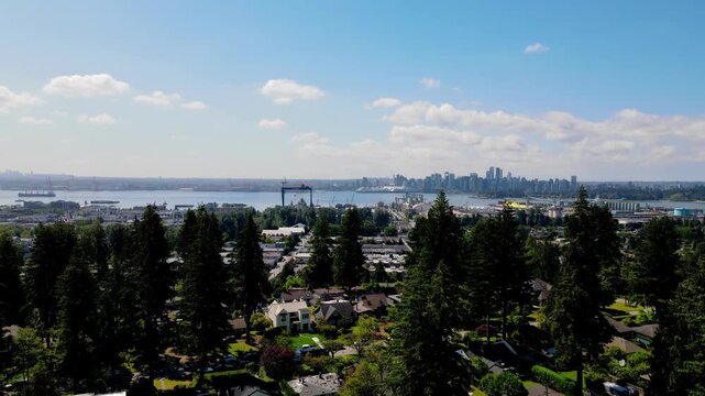 Aerial view of downtown Vancouver, Canada with North Vancouver in the foreground