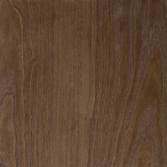 A detailed view of a brown wood grain texture, showing natural, vertical lines.