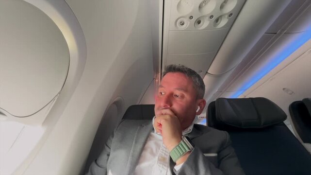 Nervous businessman on a long flight