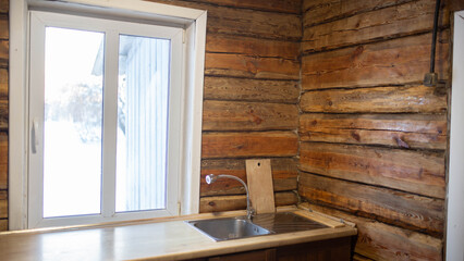 Fototapeta premium a wooden beam wall in the kitchen