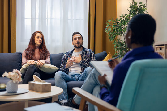 Couple discussing relationship problems during psychotherapy session