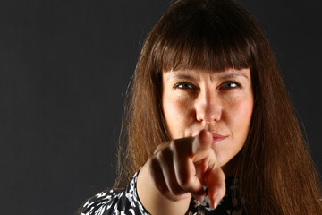 Studio Portraits of a Brunette Woman with Facial Expressions and Hand Gestures
