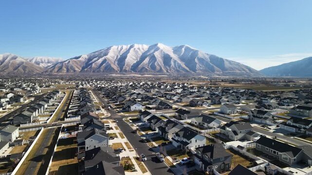 Snow capped mountain over the suburbs in the rocky mountains