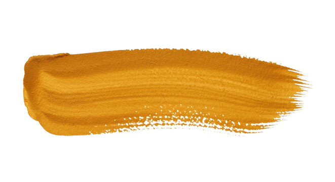 Isolated, golden ochre watercolor brushstroke with visible granulation and feathered edges on white paper, photographed flat lay against transparent background, commercial graphic design element.