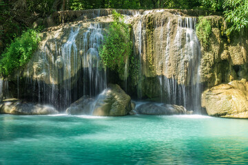 Erawan Falls, the famous seven-layered waterfall in Erawan Falls National Park In Kanchanaburi, Thailand. Water cascading over boulder into turquoise pool below.   © dhayes