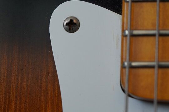 Close up macro shots of a guitar, focusing on something you wouldn't usually take notice of. 