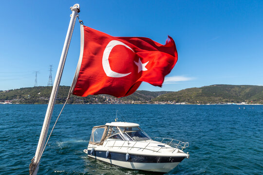 Turkish flag is waving against Istanbul