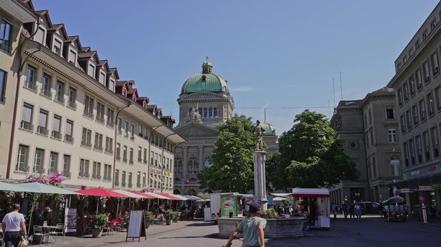 Swiss Federal Palace Dome Over Bern Market Square Caf&eacute;s,Busy Downtown City.Filmed on June 23,2025.