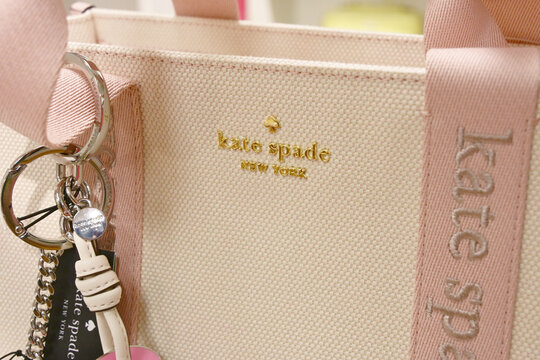 Kate Spade New York designer wear and couture fashion branding on a purse tote bag