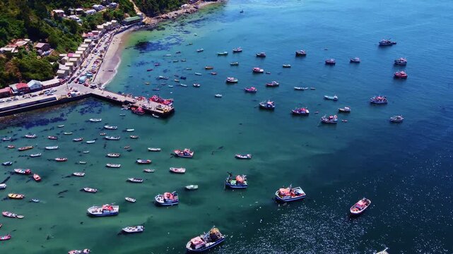 Aerial view of artisanal fishing boats in Caleta Tumbes, Talcahuano, Chile.
