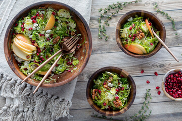 A fresh and healthy Brussels Sprouts salad with two servings beside.