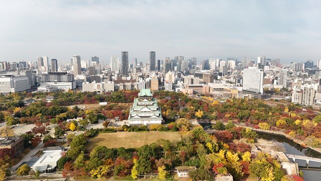 Osaka, Chuo Ward, Osaka, Japan: Aerial Drone View of Osaka Castle Park, Moat, Autumn Foliage, Historic Landmark, Japanese Architecture, City Skyline, Urban Landscape, O and Neya River