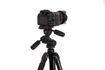 Modern camera with tripod isolated on white background. Photographer's equipment