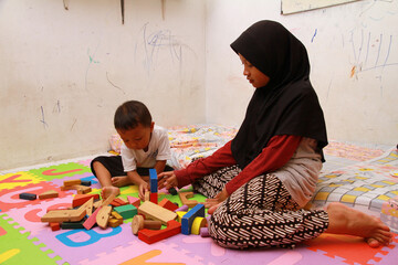 older sister is playing with her younger sister