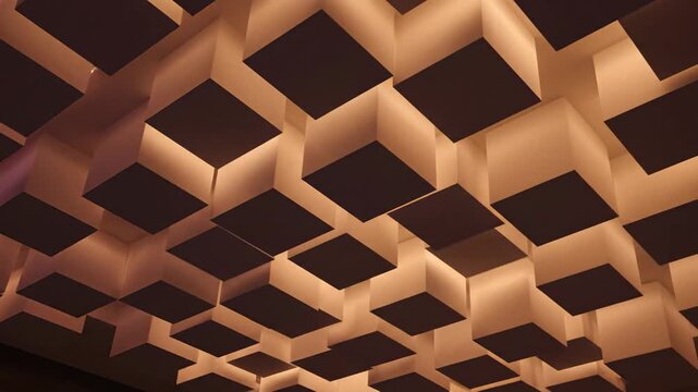 Abstract ceiling design with illuminated squares and vibrant color gradients.