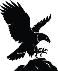 Majestic bird of prey landing on mountain peak silhouette