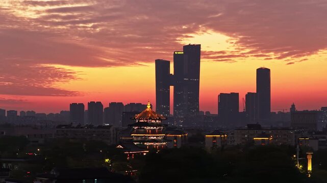 Traditional Chinese architecture and modern city sunset