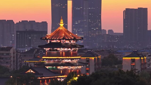 Traditional Chinese architecture and modern city sunset