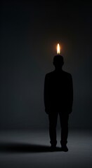Obraz premium Silhouette of a person with a glowing light bulb above their head in a dark room, symbolizing an idea or inspiration.