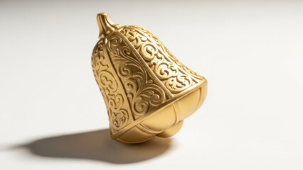 Close-up of a gold-colored decorative object with intricate patterns on a white
