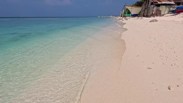 Ukulhas maldives bikini beach white sand remote exotic island palm trees