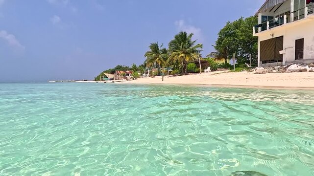 Ukulhas maldives bikini beach white sand remote exotic island palm trees