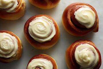 Fototapeta premium Platter of warm, freshly baked cinnamon rolls with creamy white frosting, a delightful breakfast treat.