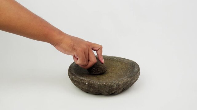 Hand Grinding Spices Using Traditional Mortar and Pestle