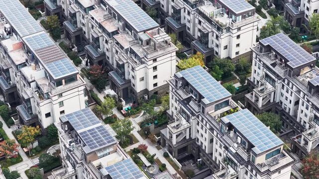 Aerial view of modern eco city with solar panels on roof