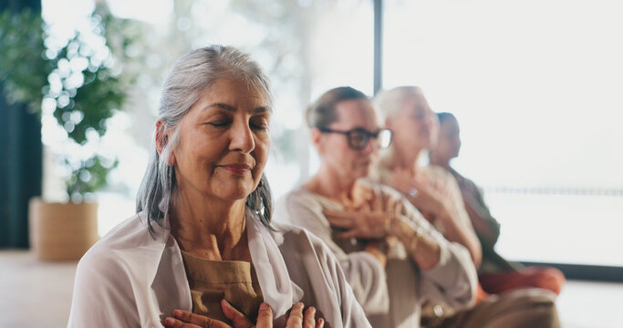 Breathing, exercise and meditation with senior women in studio for balance, inner peace or mindfulness. Awareness, fitness and yoga with group of zen old people in wellness class for mental health