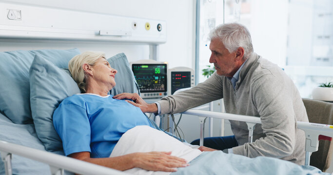 Old couple, support and visit by hospital bed with empathy, kindness and update for surgery recovery. Married, elderly people and conversation in medical clinic with love, care and hope for healing.