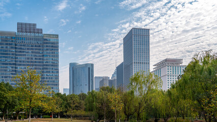 Fototapeta premium Urban Landscape with Modern Skyscrapers and Greenery