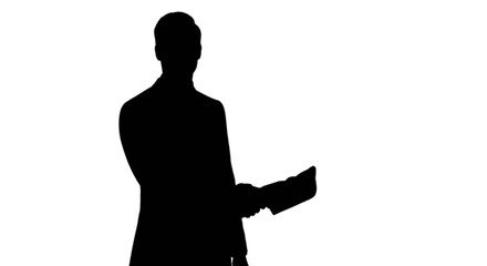 Silhouette of person holding object