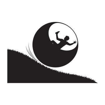 Black silhouette of a person inside a zorbing ball rolling down a steep grassy hill.