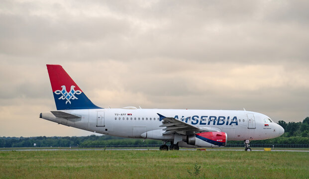 Air Serbia Airbus A319 is taxiing at the Milano Malpensa International Airport