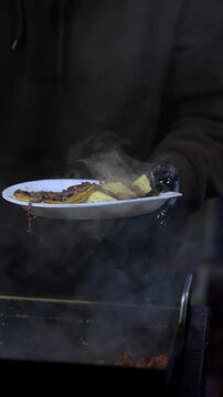 Vertical 9:16 slow motion close-up of carne asada tacos with grilled beef, fresh tortillas, and salsa at a Southern California taco stand, ideal for restaurant advertising and social media marketing