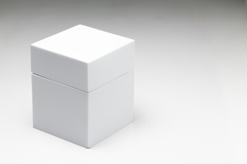 Small white box on a large white box against a white background