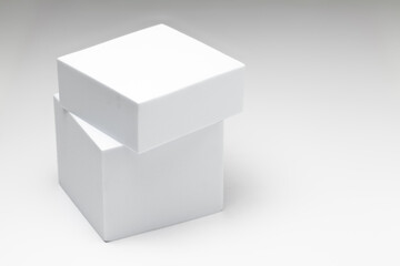 Small white box on a large white box against a white background