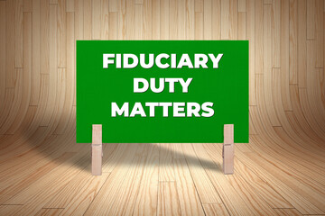 Concept words Fiduciary Duty Matters, Dark Green Rectangle Card Held By Clothespin Wooden Texture...