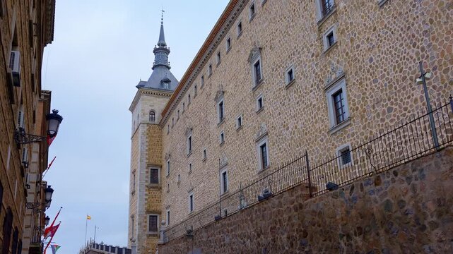 Tower and stone facade of the enormous Alcazar of Toledo in the city of the same name, Spain.