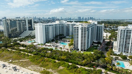 A panoramic aerial view features 1 Hotel Miami Beach framed by the Atlantic Ocean and Miami’s resort skyline. © Noah Densmore