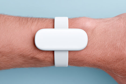 White wearable health sensor on wrist close up minimal style technology device fitness tracker health monitoring gadget modern design
