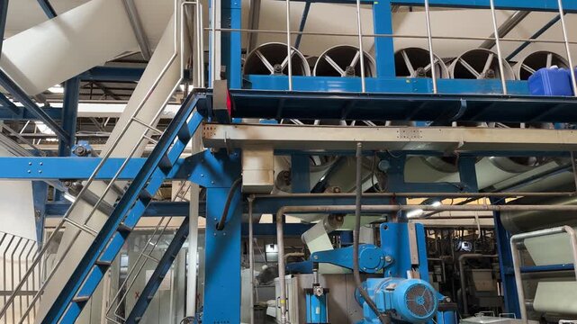 Textile mercerizing machine processing fabric in industrial factory