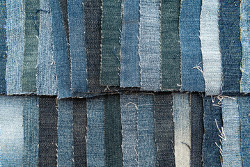 Texture from torn pieces of denim. Jeans texture. Material for sewing clothes