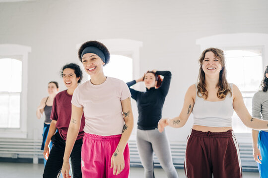 Diverse women enjoying group dance fitness class